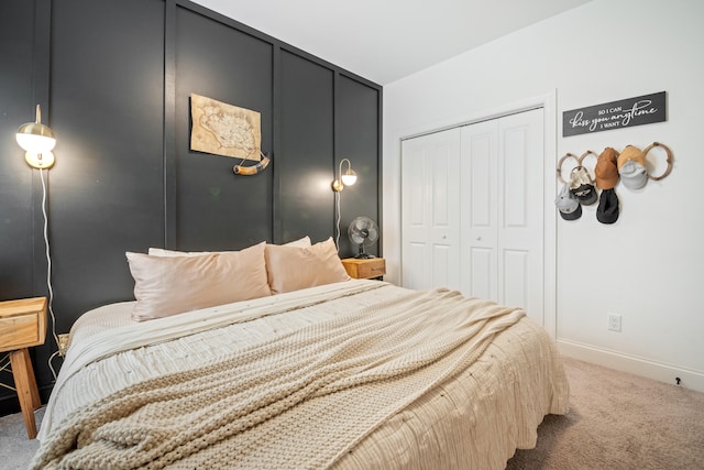 bedroom with carpet and a closet