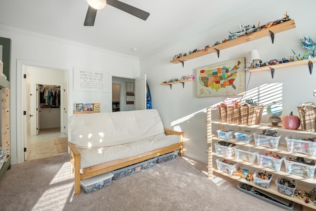 interior space with carpet flooring, crown molding, and ceiling fan