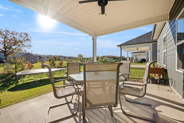 view of patio with a trampoline and ceiling fan