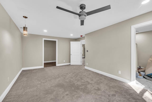 interior space with ceiling fan and light carpet