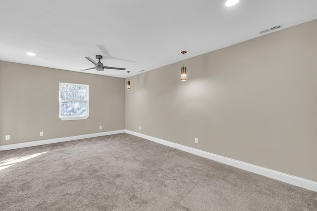 carpeted empty room with ceiling fan