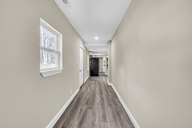 hallway featuring light hardwood / wood-style flooring