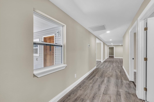 hall with light hardwood / wood-style flooring