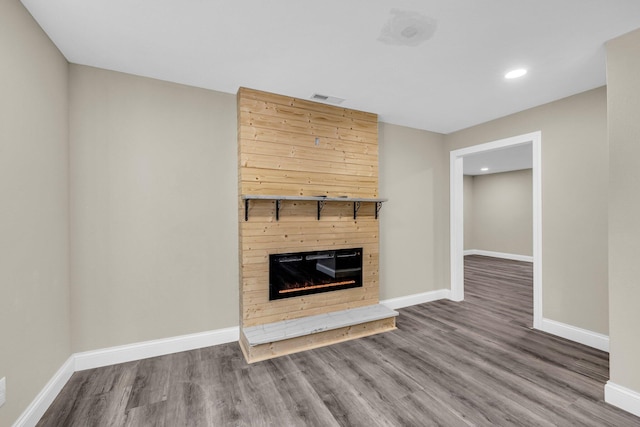 unfurnished living room with wood-type flooring