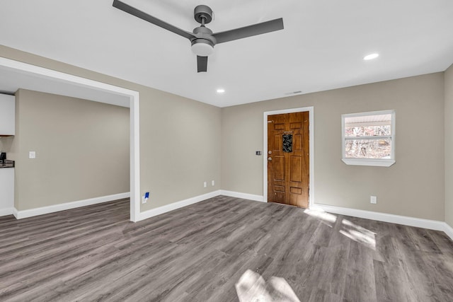 interior space with ceiling fan and wood-type flooring