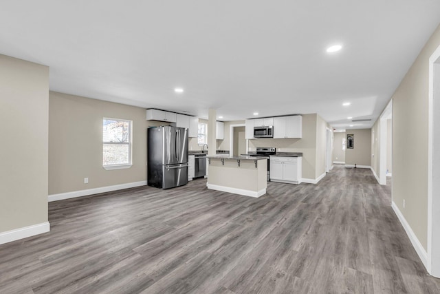 unfurnished living room with light wood-type flooring