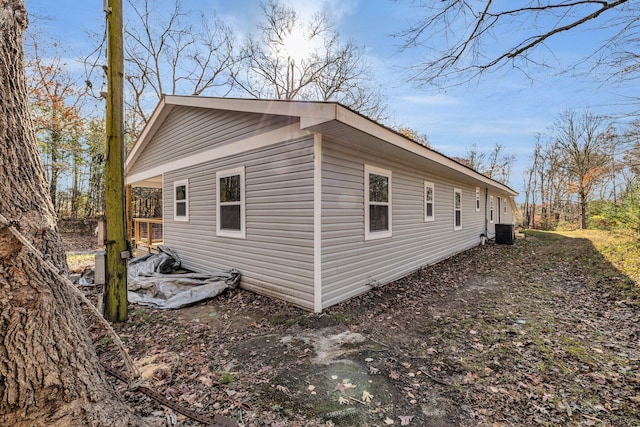 view of side of property with central AC unit