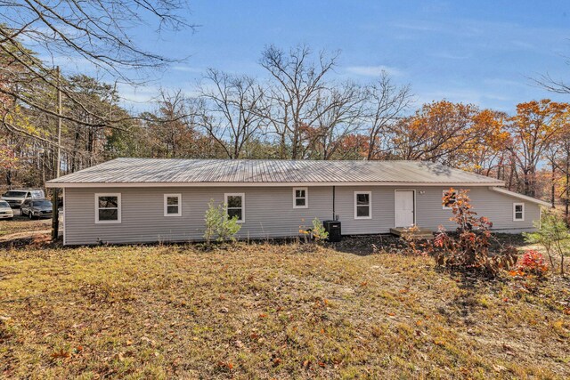 rear view of house with central AC