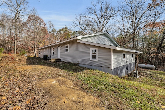 view of property exterior with central AC