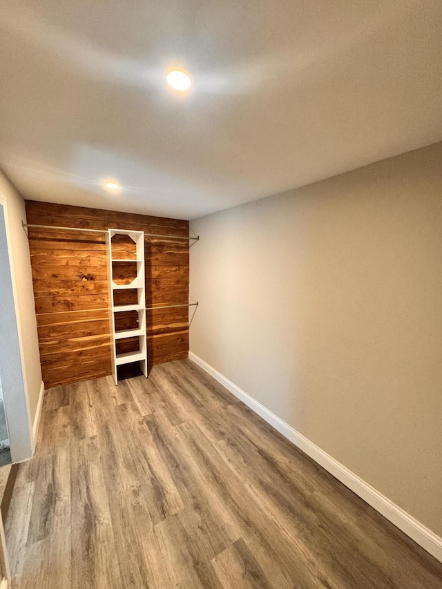 unfurnished bedroom with hardwood / wood-style flooring