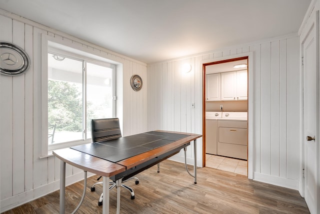 office with hardwood / wood-style floors and washer and dryer