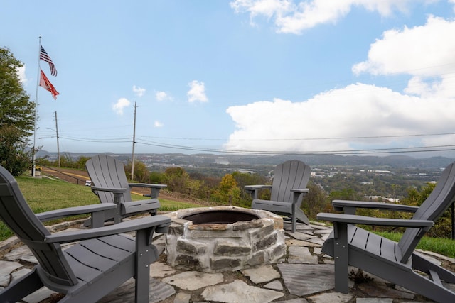 view of patio / terrace featuring an outdoor fire pit