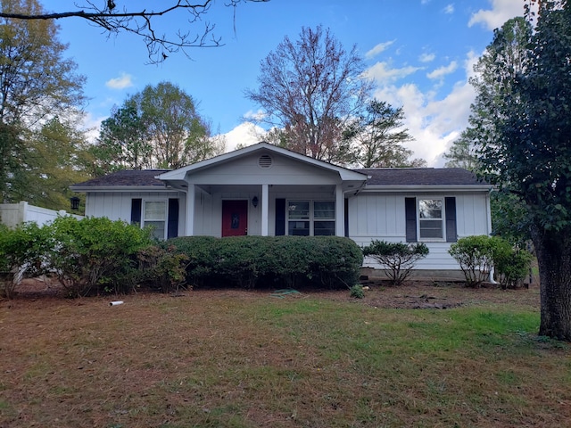 ranch-style home with a front yard