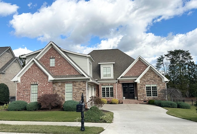 craftsman-style home with a front lawn