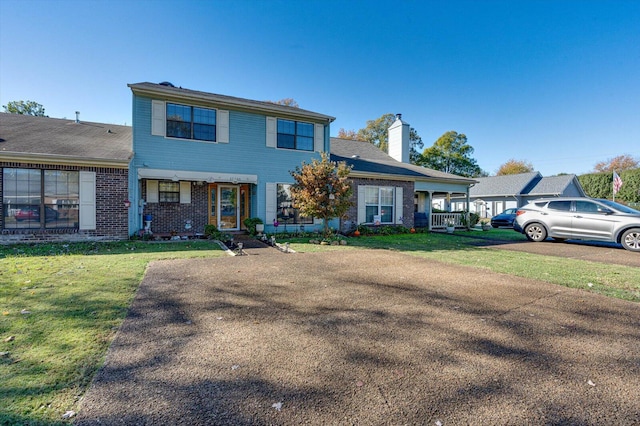 view of front of home featuring a front yard