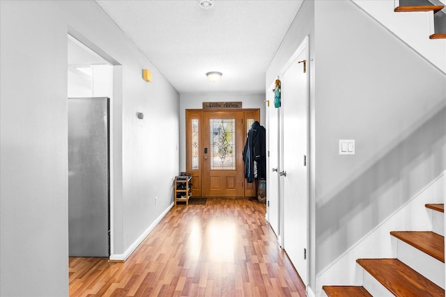 entrance foyer with light hardwood / wood-style flooring