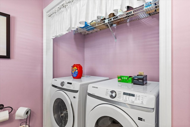 washroom with washing machine and dryer