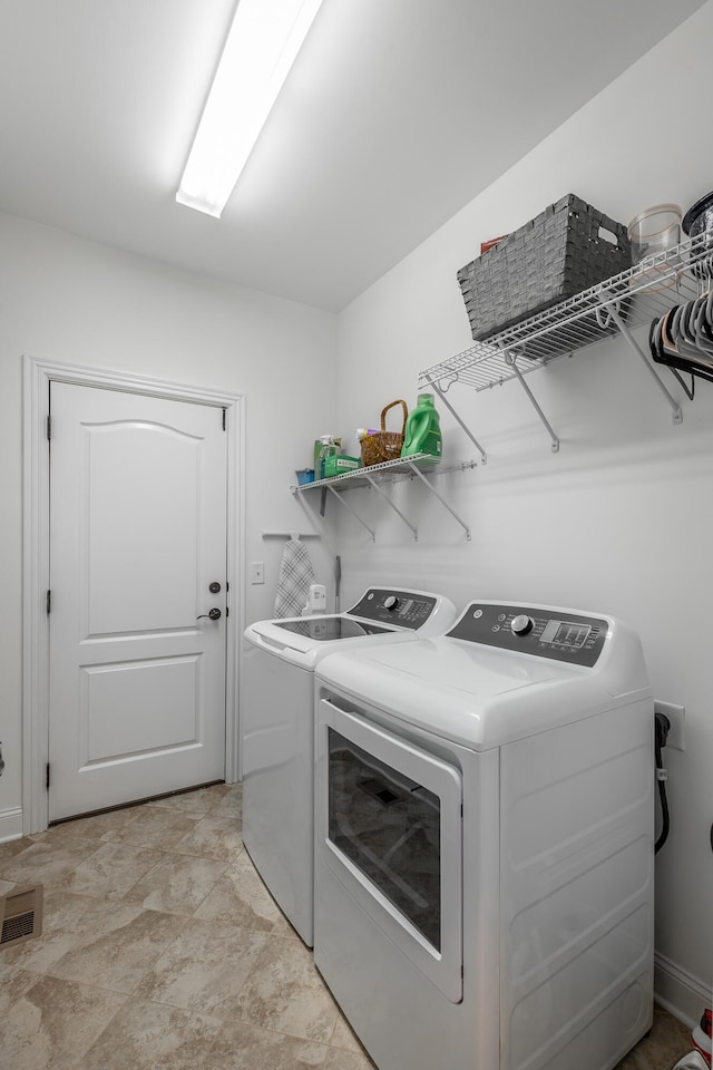 laundry area featuring separate washer and dryer