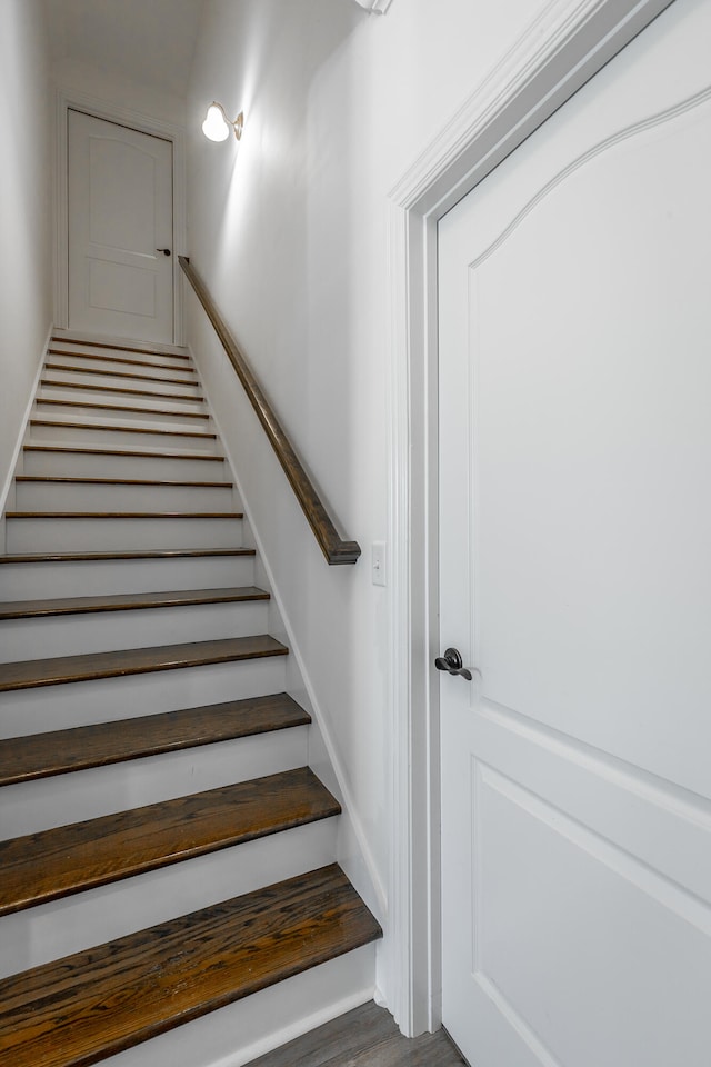 stairway featuring hardwood / wood-style flooring