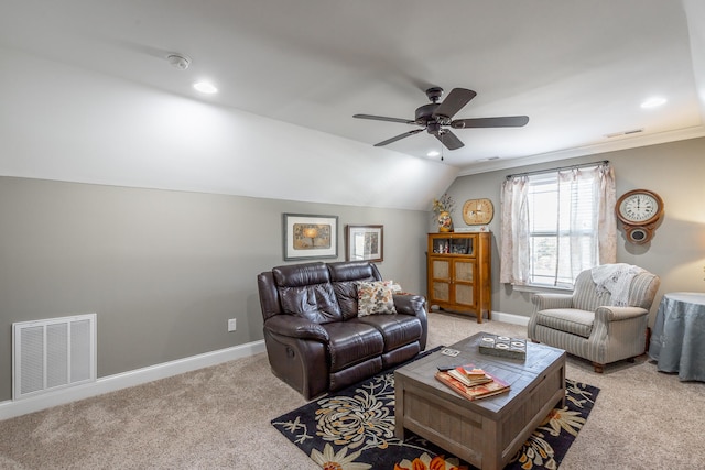 carpeted living room featuring ceiling fan, ornamental molding, and vaulted ceiling