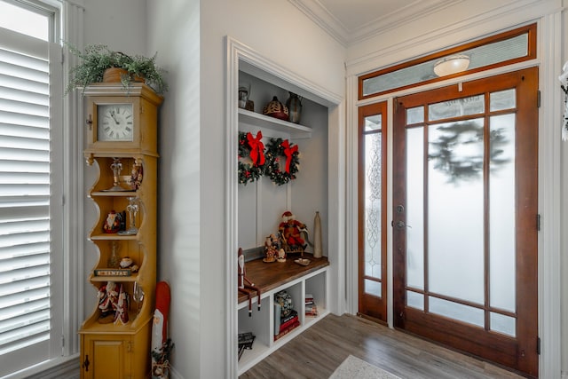 mudroom with light wood-type flooring, a wealth of natural light, and crown molding