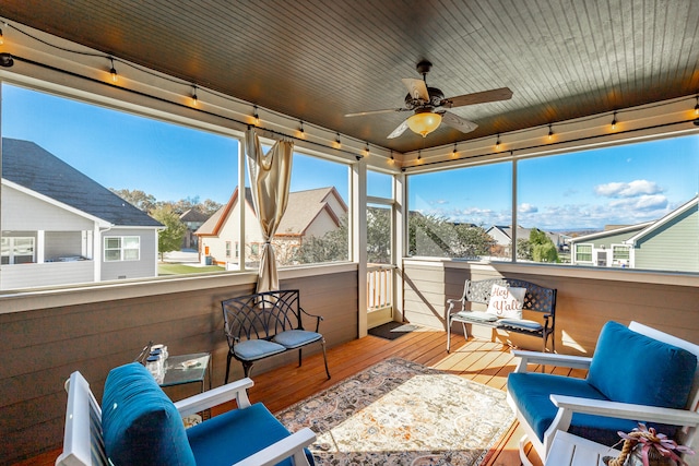 sunroom / solarium with ceiling fan