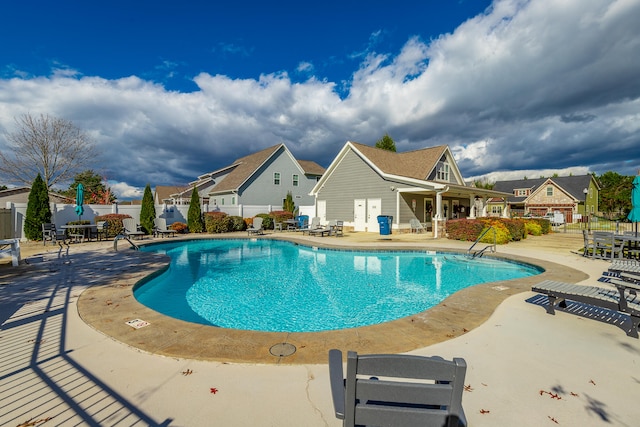 view of pool featuring a patio