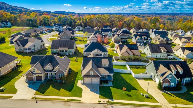 birds eye view of property with a mountain view