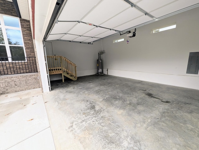 garage with a garage door opener, electric panel, and gas water heater