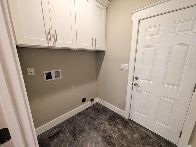 laundry room with washer hookup and cabinets