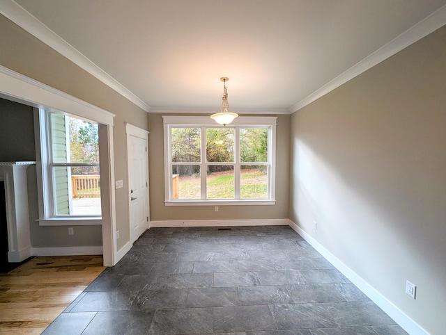 unfurnished dining area with ornamental molding