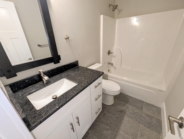 full bathroom with shower / washtub combination, vanity, tile patterned floors, and toilet