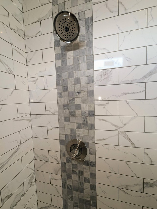 bathroom with tiled shower