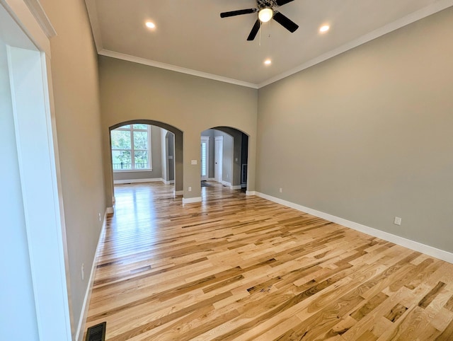 unfurnished room featuring ornamental molding, ceiling fan, and light hardwood / wood-style floors