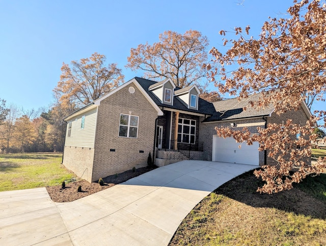 view of front of property featuring a garage and a front lawn