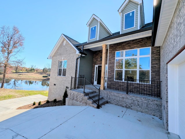 view of front facade featuring a water view