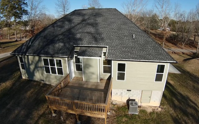 back of property with a wooden deck and central air condition unit