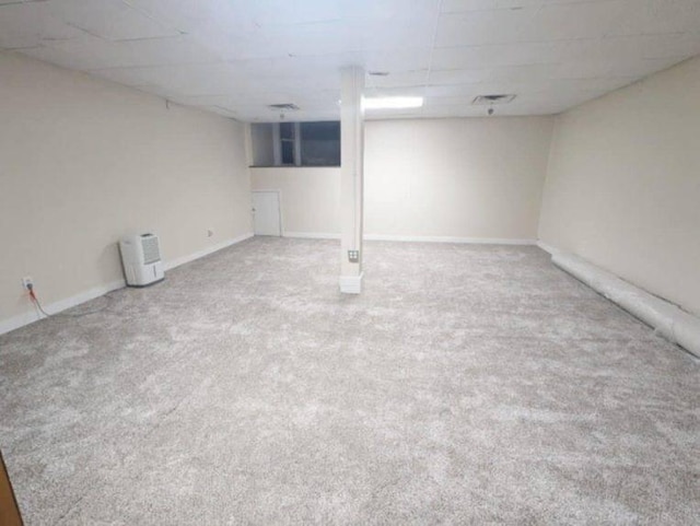 basement featuring carpet flooring