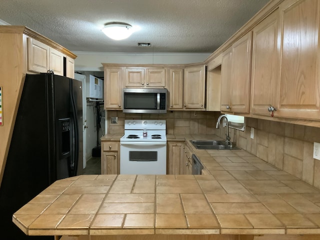 kitchen featuring white range with electric cooktop, tile counters, sink, and light brown cabinetry