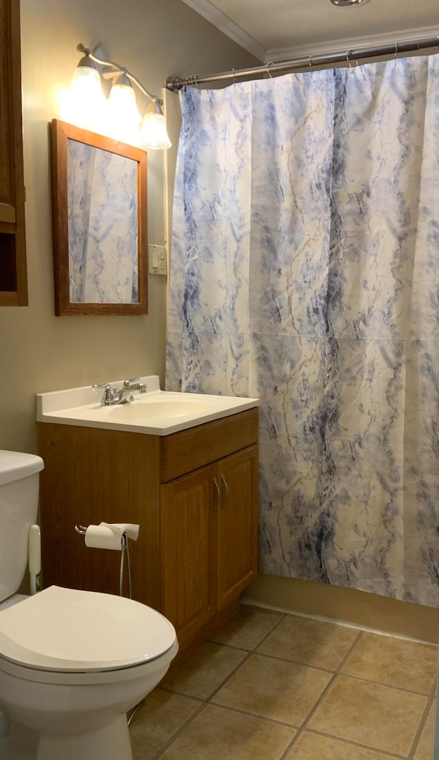 bathroom featuring walk in shower, tile patterned flooring, crown molding, toilet, and vanity