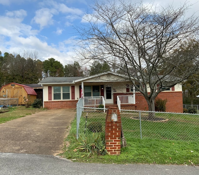 bungalow featuring a porch and a front yard