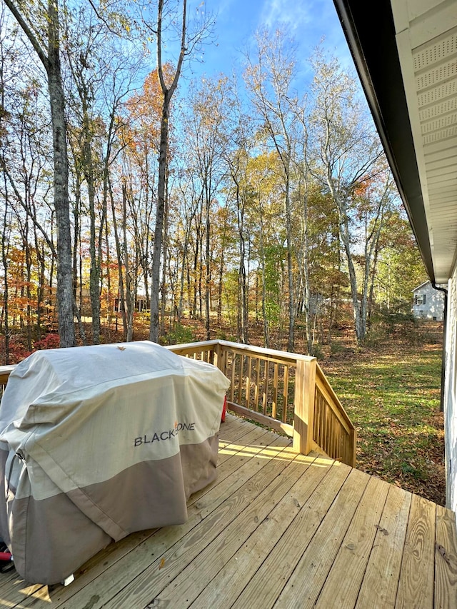 wooden deck with grilling area