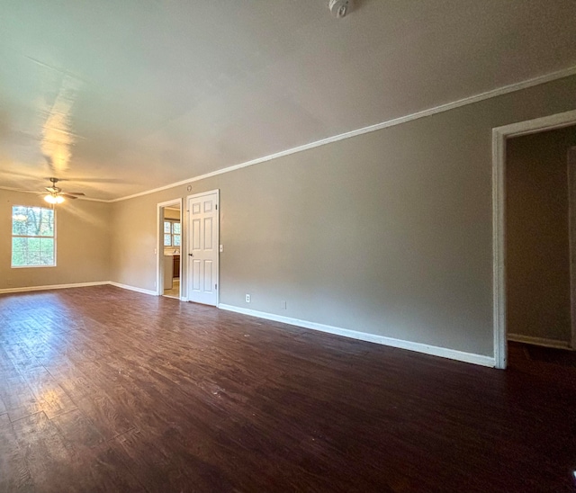 unfurnished room with ceiling fan, dark hardwood / wood-style flooring, and ornamental molding