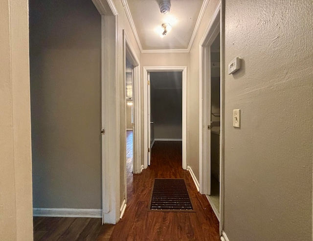 hall featuring dark hardwood / wood-style floors and ornamental molding