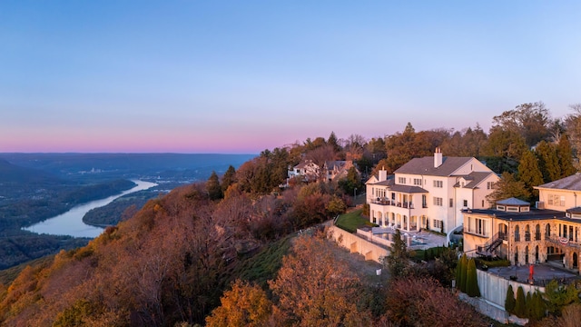 aerial view at dusk with a water view