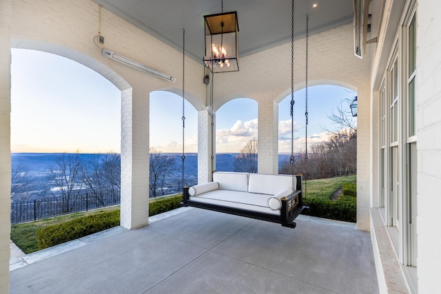 view of patio terrace at dusk