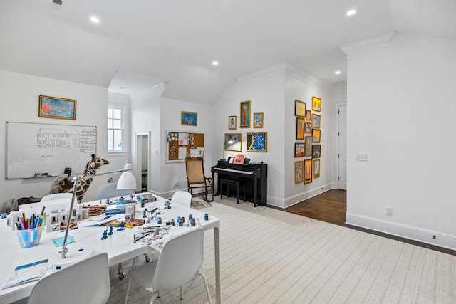 home office with hardwood / wood-style floors, crown molding, and lofted ceiling