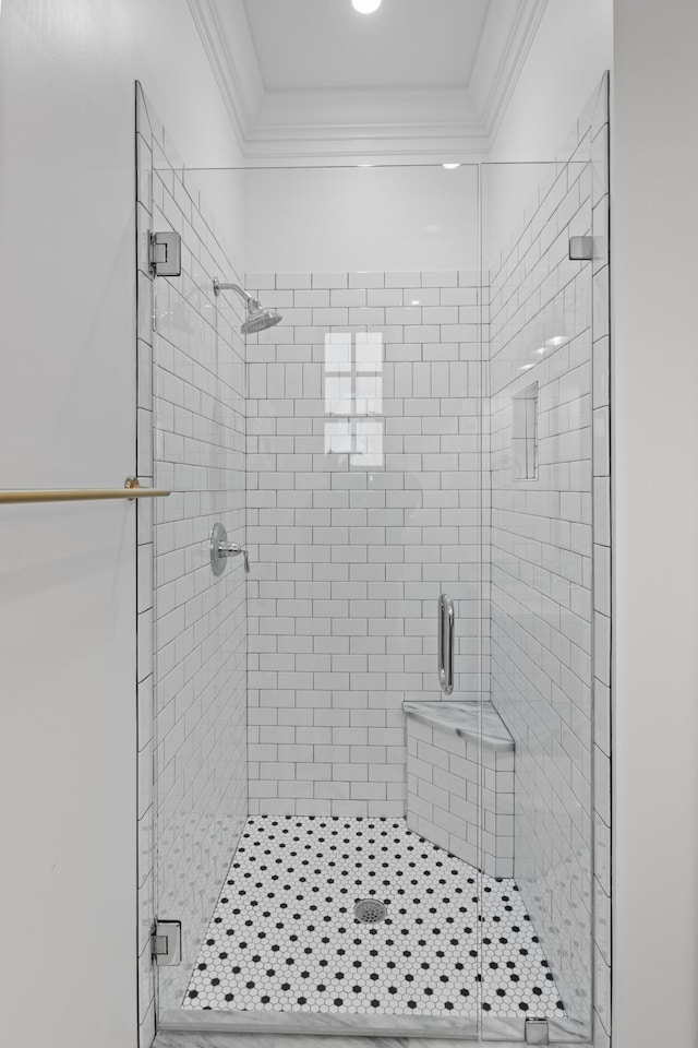 bathroom with walk in shower and crown molding