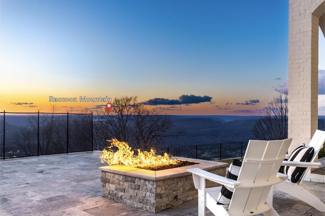 patio terrace at dusk with a fire pit