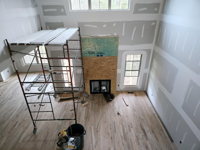 unfurnished living room with hardwood / wood-style flooring